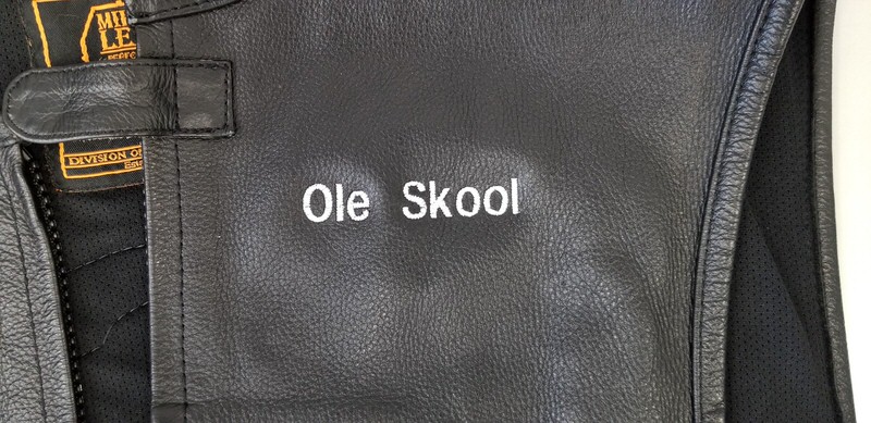 Letter embroidery over leather